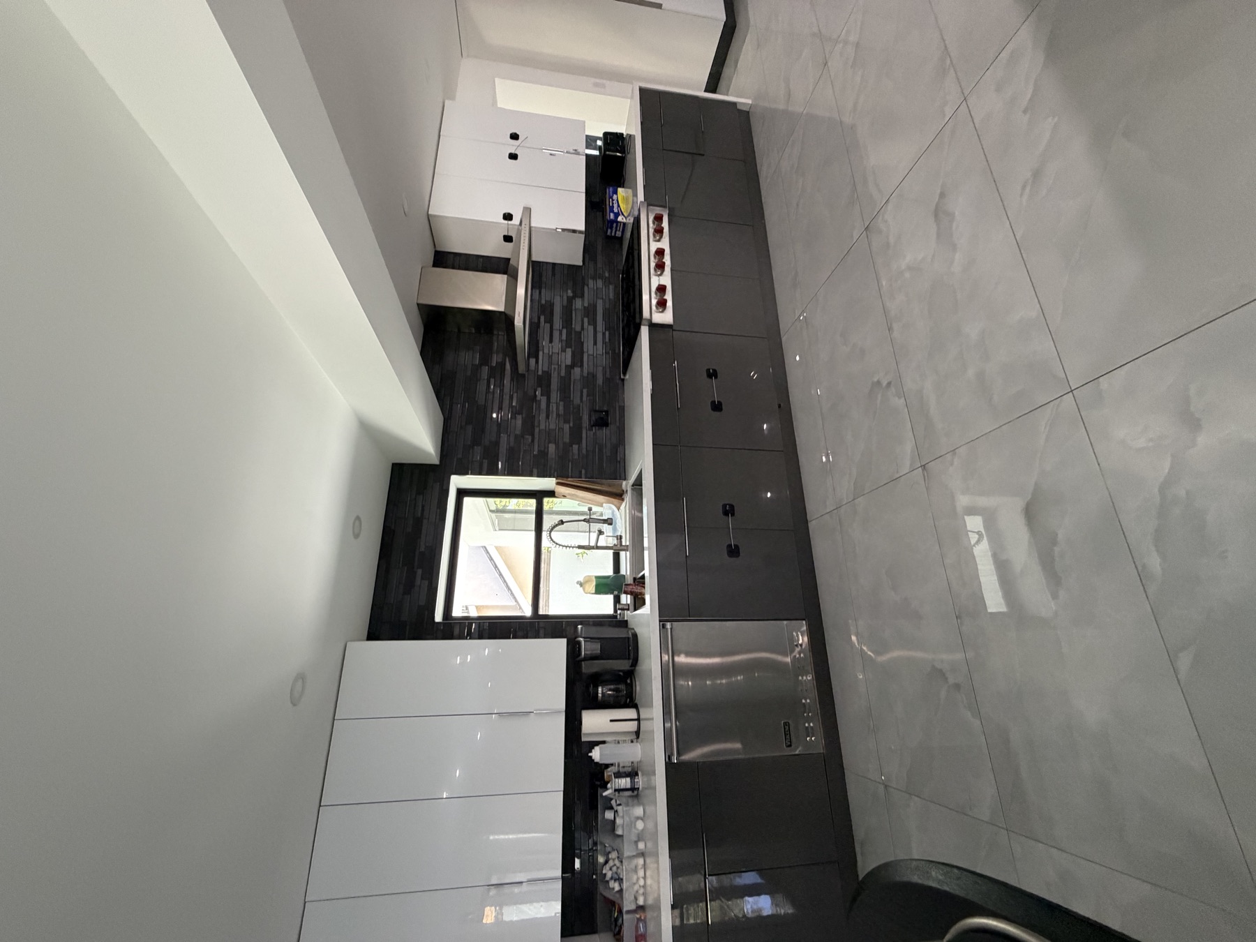 Modern open kitchen with marble floors
